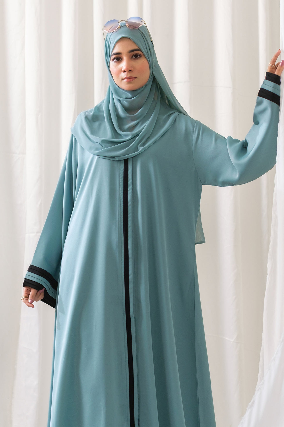 Dhaagey Aqua Serene Abaya in Imported Nidha Fabric with Black Contrast Trim, full view.