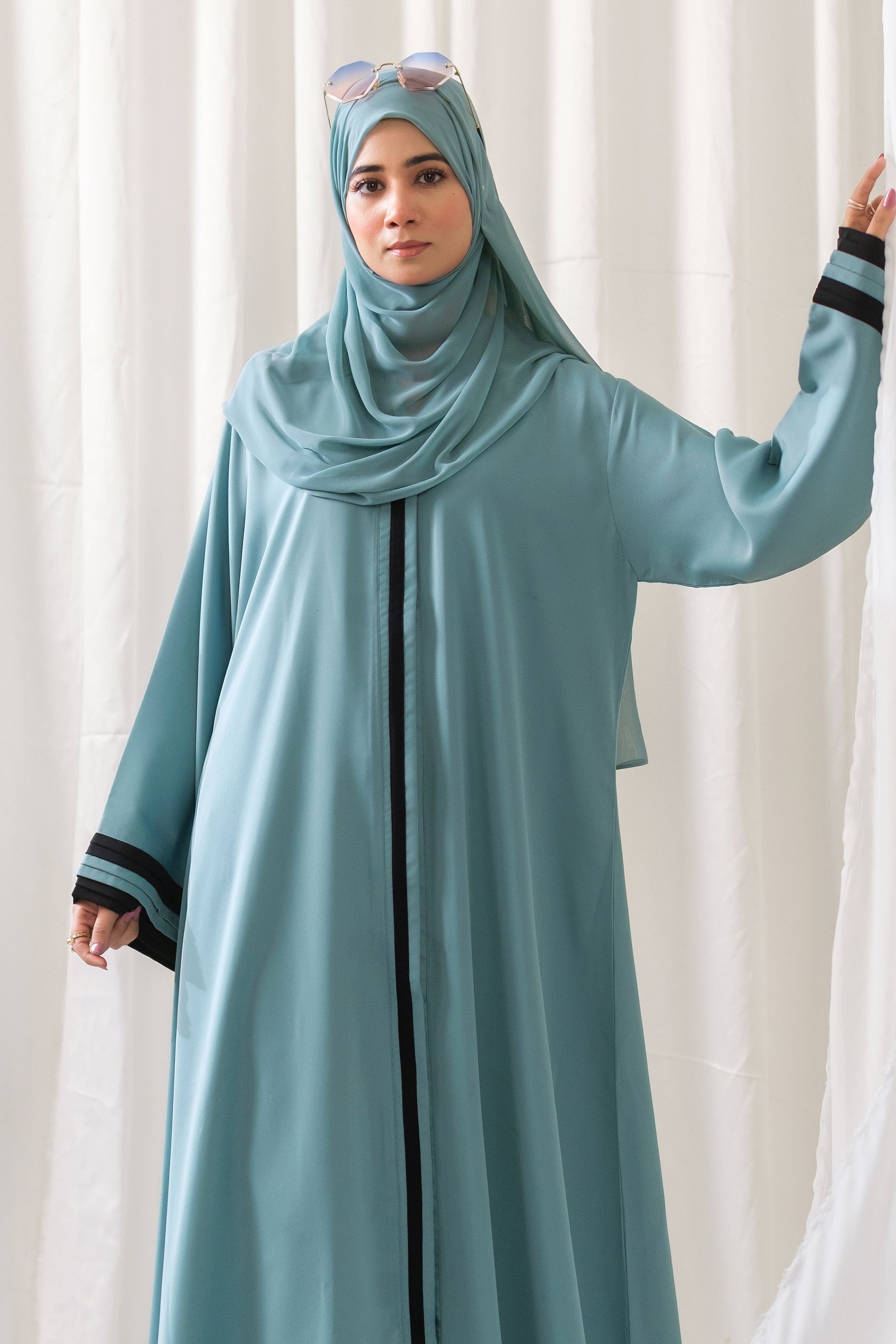Dhaagey Aqua Serene Abaya in Imported Nidha Fabric with Black Contrast Trim, full view.