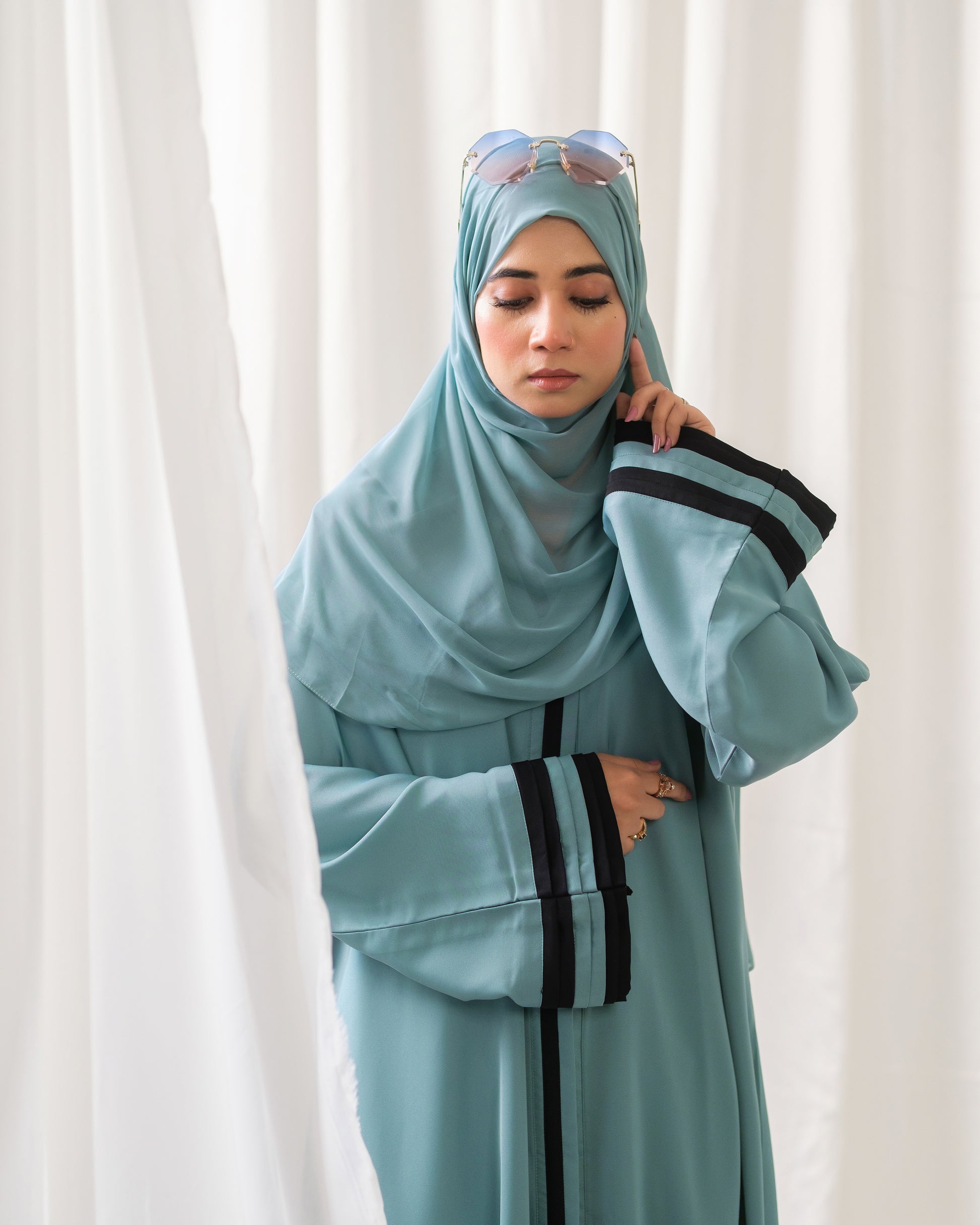 Dhaagey Aqua Serene Abaya in Imported Nidha Fabric with Black Contrast Trim, close view