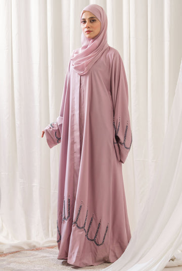 Dhaagey Azure Arch Front-Open Abaya in Nude Pink Nidha, showing dark scalloped beadwork on the hem and sleeves.