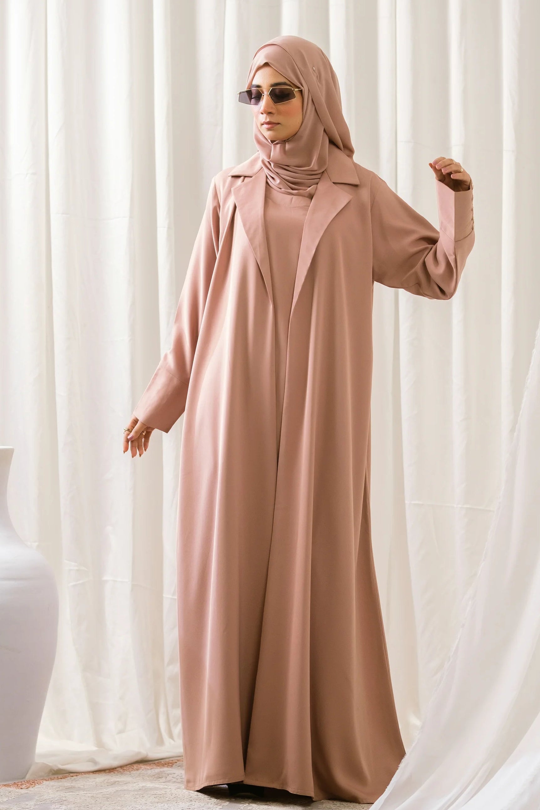 Dhaagey City Trench Abaya in Dusty Pink/Mauve, full length, showing front-open trench coat style and attached inner piece.