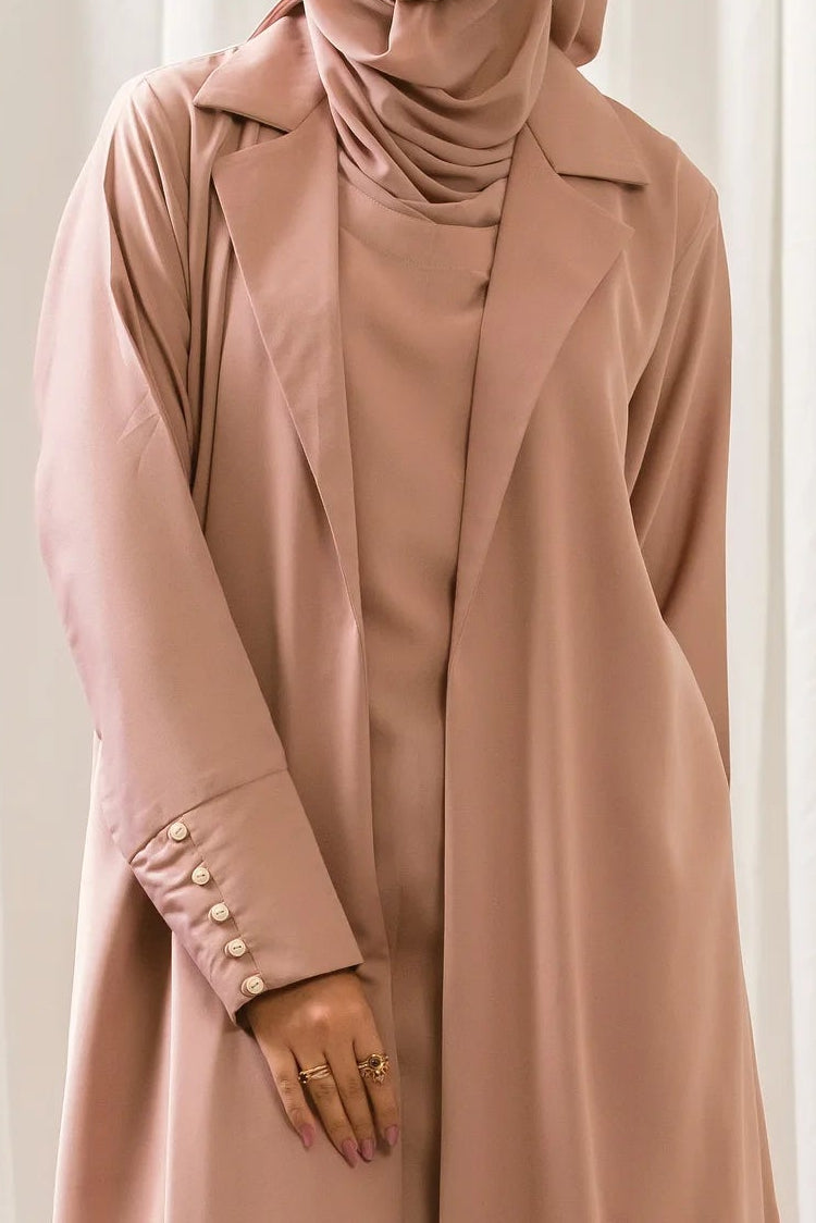 Dhaagey City Trench Abaya in Dusty Pink/Mauve, full length, showing front-open trench coat style and attached inner piece. Front