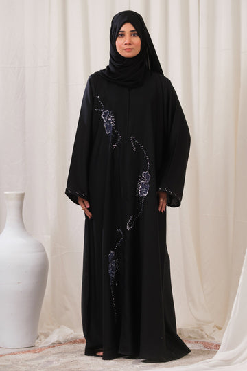 Dhaagey Cosmic Trail Front-Open Abaya in Black Nidha, showing vertical trail of blue and silver beaded floral design and matching Chiffon hijab.