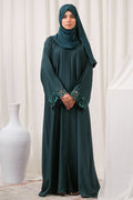 Dhaagey Emerald Cut Front-Open Abaya in Deep Emerald Nidha, showing floral cutwork cuffs and matching Chiffon hijab.