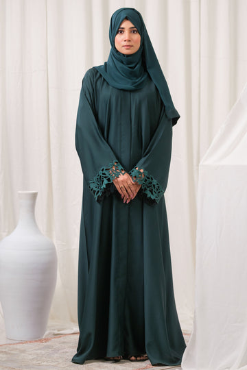 Dhaagey Emerald Cut Front-Open Abaya in Deep Emerald Nidha, showing floral cutwork cuffs and matching Chiffon hijab.