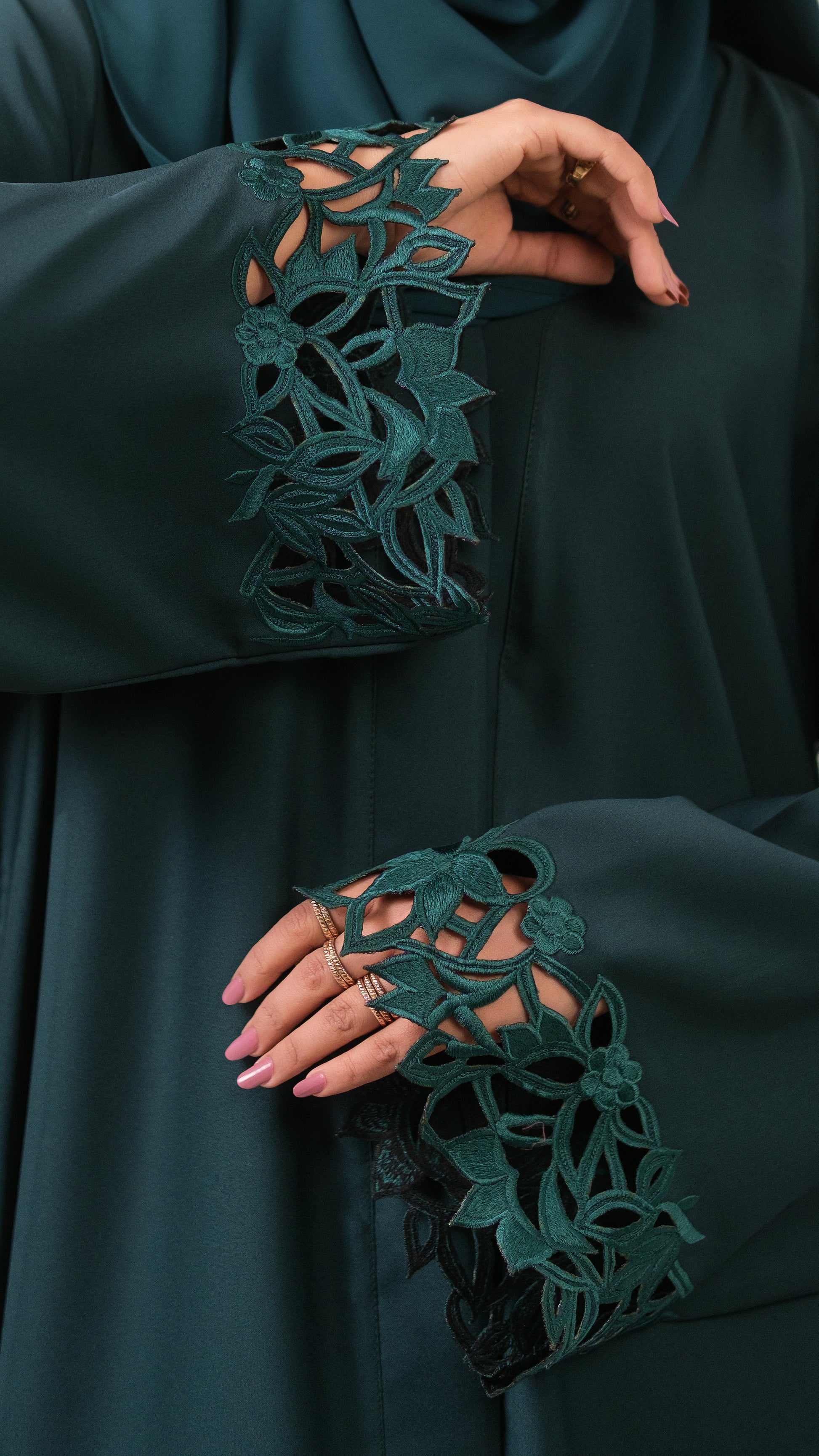 Dhaagey Emerald Cut Front-Open Abaya in Deep Emerald Nidha, showing floral cutwork cuffs 