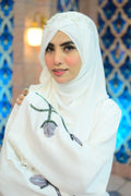 Dhaagey Pearl Blossom abaya with hand-applied grey fabric petals and beadwork